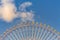 Bottom view, giant ferris wheel against blue sky