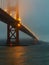 Bottom view of the Golden Gate Bridge in San Francisco in foggy and overcast weather, evening, strong wind. Concept, travel,