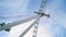 Bottom view of modern Ferris wheel on blue sky background. Action. Ferris wheel doesn`t work on clear day. Many lines