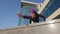 Bottom view muslim islamic strong athletic woman strength power girl in hijab doing balance on hands holding legs in air