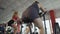 Bottom view of obese female working at stationary bike in the sports club