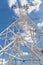 Bottom view power transmission lines against blue sky