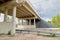 Bottom view of the prestressed concrete beams and piers of bridge crossing many-lane expressway of road