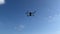 Bottom view of a quadcopter flying in the sky