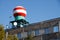 Bottom view of the red-white sphere on the building of the meteorological service against the blue sky