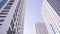 Bottom view of residential buildings with blue sky. Frame. Bottom view of facade of modern multi storey house