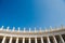 bottom view of statues at St Peters Square on blue sky