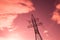 bottom view of the tower of power grids on pink sky background, High voltage, Electricity concept