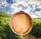 The bottom of a wine barrel on a white background