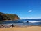 Boudi national park beach with blue clear sky surrounding sea and lots of greenness