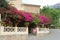 Bougainvillea and a man on a bench, Fornalutx, Majorca