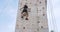 Boulder climber woman exercising at outdoor climbing gym wall
