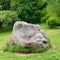 Boulder and footpath. The big boulder closeup and footpath in  park in sunny summer day