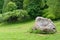 Boulder and footpath. The big boulder closeup and footpath in  park in sunny summer day