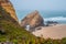 Boulder of Guincho at Santa Cruz beach in aerial view from maritime vegetation on foggy day Torres Vedras PORTUGAL