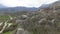 Boulders at foot of mountain. Shot. Drone view of extreme flight over boulders and rocks on mountain slopes. Natural