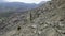 Boulders at foot of mountain. Shot. Drone view of extreme flight over boulders and rocks on mountain slopes. Natural