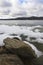 Boulders by the frozen lake