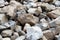 boulders, pebbles and sand from the bottom of a mountain river