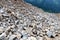 boulders, pebbles and sand from the bottom of a mountain river