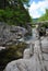 Boulders, River and a Foot Bridge