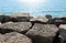 Boulders and sparkling blue lake