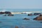 Boulders and stone laying in shallow water