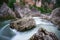 Boulders and swirling stream