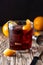 Boulevardier cocktail in glass on wooden table