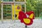 Bouncy shape of rooster equipment, rope ladders, wooden bridge in child playground