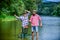 Bound Together In Love. two happy fisherman with fishing rods. summer weekend. mature men fisher. father and son fishing