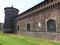 Boundaries and cylindrical tower of the castle Sforzesco to Milan in Italy.