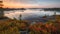 Boundary waters canoe trip. Beautiful river sky cloud reflection. Fir trees pristine wilderness.