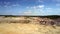 Boundless landscape with clay quarry under blue sky