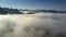 Boundless upper panorama hills protrude from thick fog