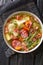 Bouneschlupp Green Bean Soup from Luxembourg close-up in a plate. Vertical top view