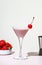 Bounty martini summer alcoholic cocktail drink with vodka, liqueur, cream, syrup, strawberries and ice in glass with cocktail