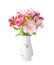 Bouquet of Alstroemeria flowers in old porcelain vase isolated on white background