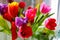 Bouquet aromatic colorful garden tulips with a blurred background