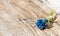 Bouquet of beautiful blue flowers on a wooden vintage table. Small flowers are muscari or viper onion. A small bouquet for the