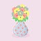 Bouquet of beautiful flowers in a polka dot vase