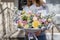 Bouquet of beautiful flowers in women`s hands. Floristry concept. Spring colors. the work of the florist at a flower