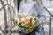 Bouquet of beautiful flowers in women`s hands. Floristry concept. Spring colors. the work of the florist at a flower