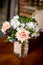 Bouquet of beautiful mixed flowers in vase on a table. Lovely bunch of flowers. Work of the professional florist. Wedding or home