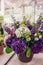 Bouquet of beautiful purple and white hydrangeas with eustoma flowers and colorful inflorescences Delphinium . Modern