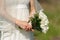 Bouquet and blooming sprig of apple in hands