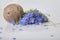 Bouquet of blue Flax flowers and Linen thread ball on a white background