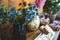 Bouquet of blueheads in a glass vase on the window of a decor and flower shop