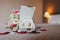 Bouquet and box with wedding rings in a bed strewn with rose petals
