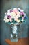 Bouquet of the bride of roses in a glass vase